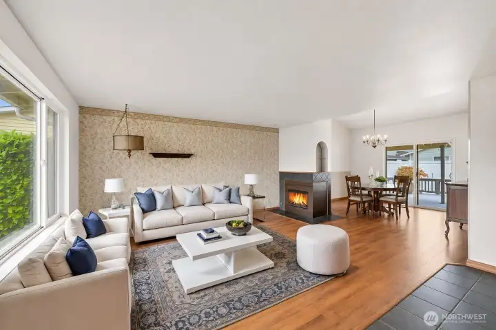 A spacious living room greets guests! Shown here with virtual staging.