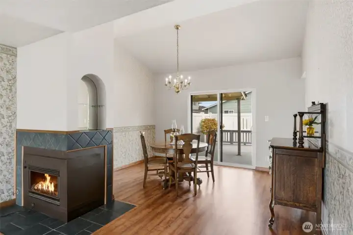 Adjacent to the living room is a large dining room with a sliding door out to the deck.