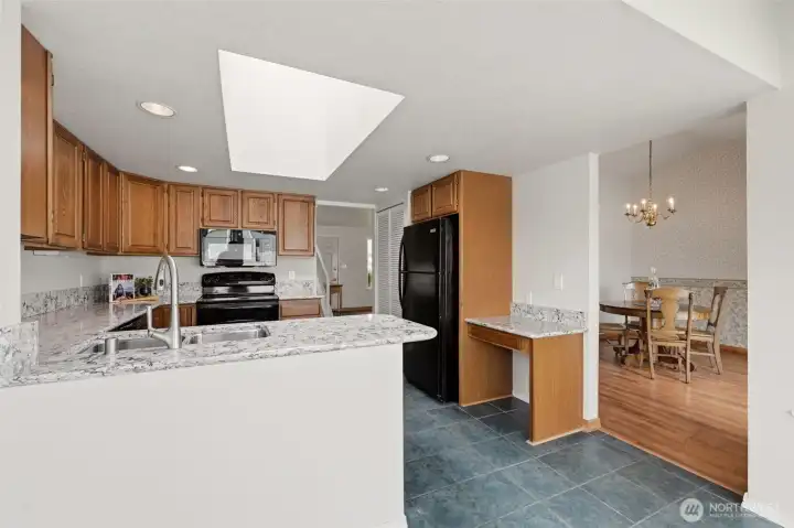 This lovely kitchen provides lots of counter space and cabinet storage!