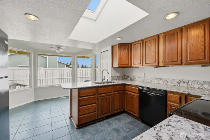 A huge skylight and fabulous bay window make the kitchen light and cheery!