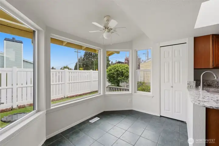 The dining nook looks out to the backyard.