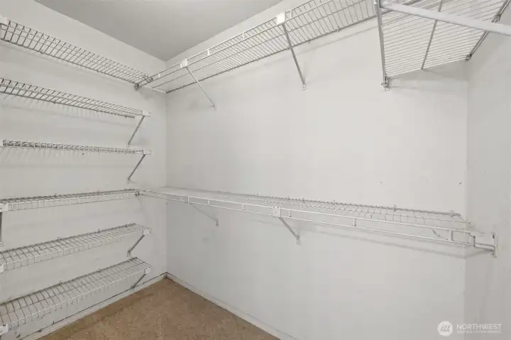 The walk-in closet comes equipped with lots of shelves to make organization easy!