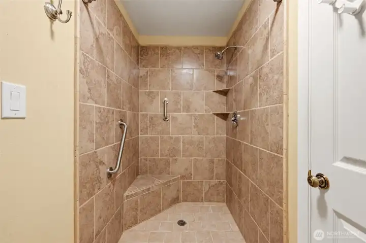 The primary suite also contains this beautifully renovated shower.