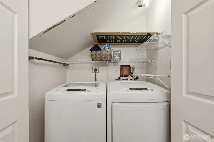 The washer/dryer unit is located in a utility closet in the power room.