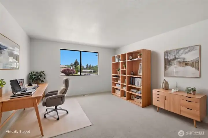 The second upstairs bedroom is shown here virtually staged as a home office!
