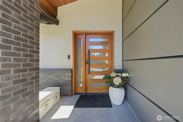 Welcoming front entrance with private setting. Welcoming front entrance with private setting.