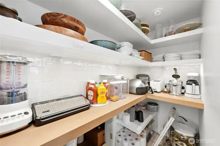 Walk-in pantry provides additional storage and organization. Walk-in pantry provides additional storage and organization.