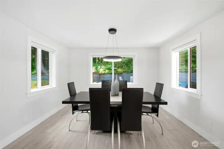 Dining area with seamless flow to indoor and outdoor living spaces. Dining area with seamless flow to indoor and outdoor living spaces.