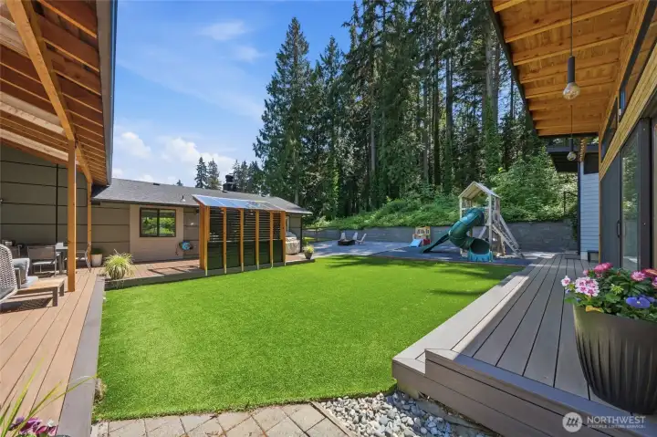 Expansive covered deck designed for year-round enjoyment. Expansive covered deck designed for year-round enjoyment.