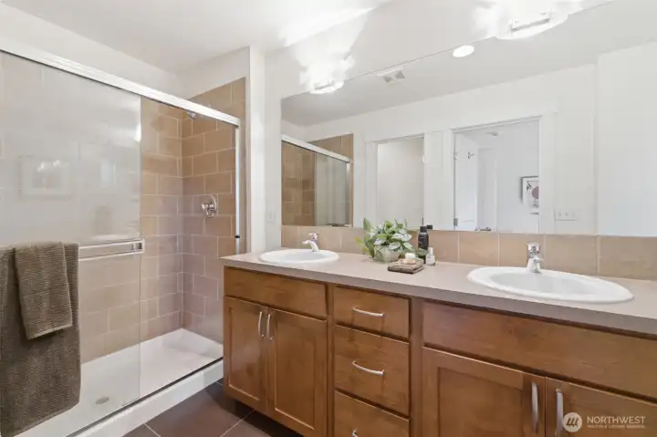 Primary ensuite bath with large soaking tub and separate tiled shower. Primary ensuite bath with large soaking tub and separate tiled shower.