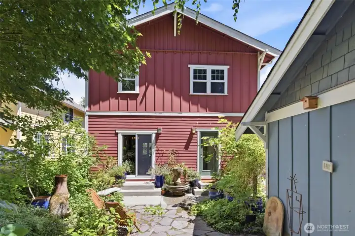 he back of the home has access to the garden through the living space sliding doors and via the mudroom for added convenience. he back of the home has access to the garden through the living space sliding doors and via the mudroom for added convenience.