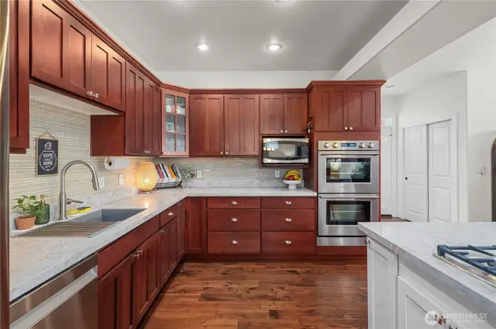 Rich deep warm colored craftsman style cabinets.....and look at all the storage!! WOW!