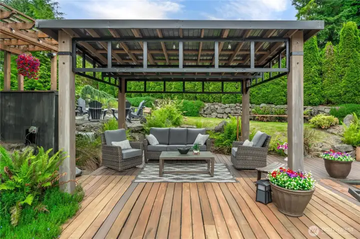 The gazebo sits just below the waterfall in the background and provides shade for the warm summer days.