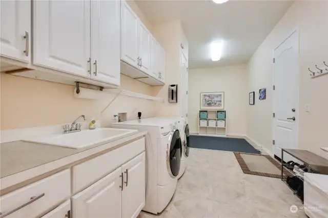 There is extra square footage in the laundry room that isn't reflected in the county records. Lots of room for additional storage cabinets, a craft area or super-sized pantry.