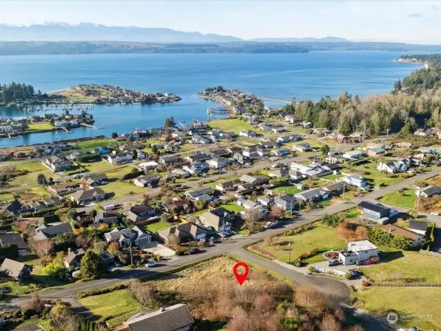 Prime .28 acre lot (next to the corner parcel) with bay and marina views