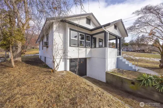 Looking from the west.  The house is partially fenced, the nice big back yard would be great for a pet.