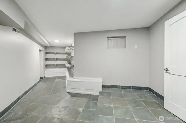 Ample Mudroom from Garage entrance and extra storage.