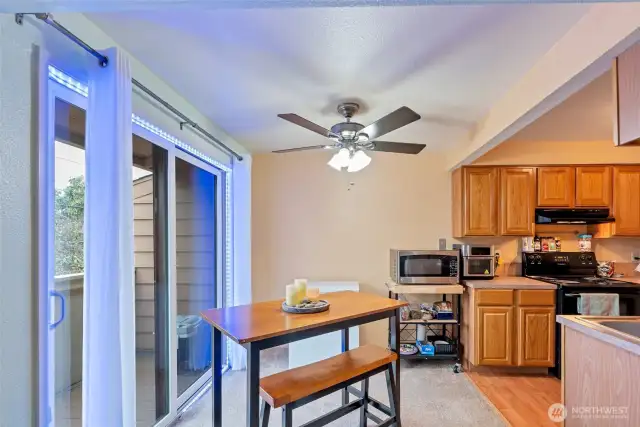 Eating area off kitchen opens out to balcony