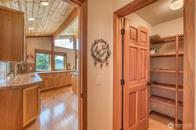 Hall to walk in pantry and washer & dryer space leading into the garage.