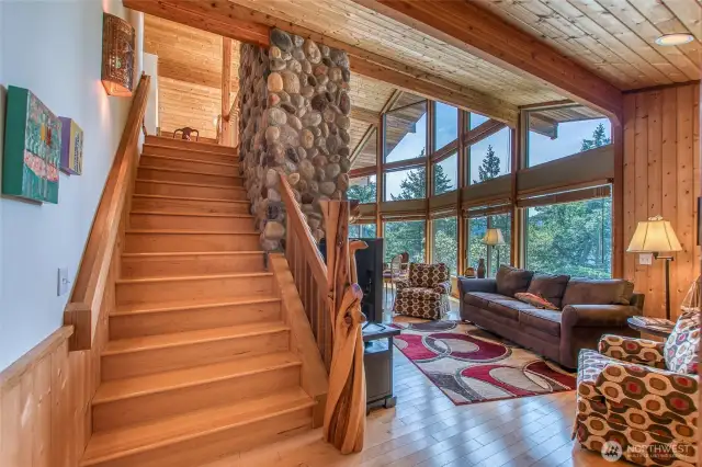 Artful juniper pine pole and stairway to the loft