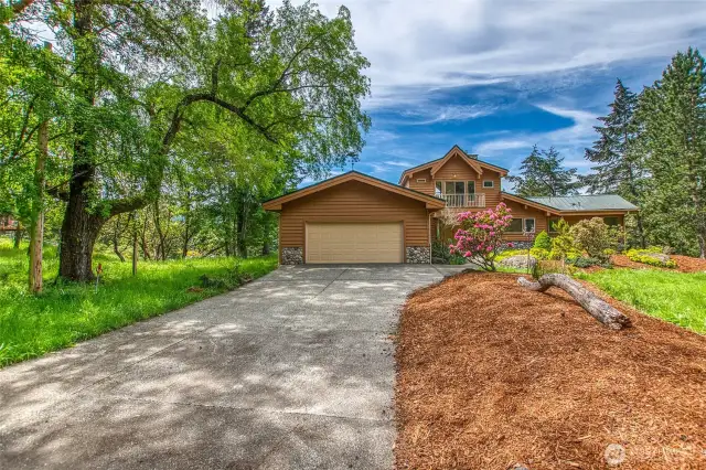 Attached 2 car garage with ample space for shop inside. Aggregate drive, big enough for a RV or boat parking