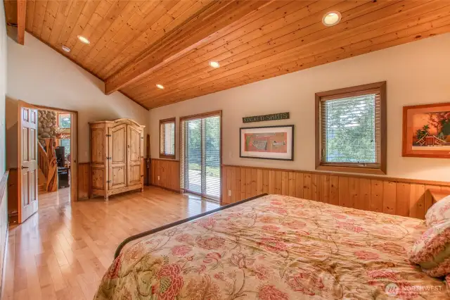 Spacious primary bedroom with sliding glass to out to the deck.