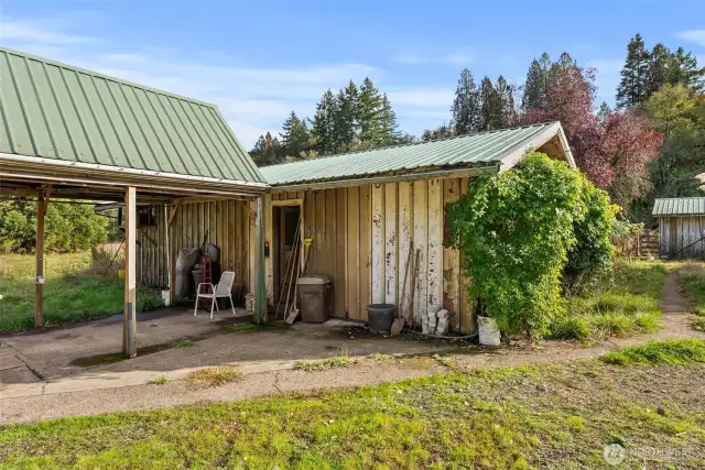 View of breezeway and entrance to workshop and meat locker/freezer.