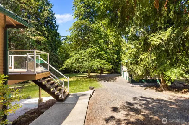 Driveway access along the side of the home to the shop