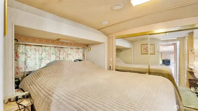 Comfortable queen-size bed offers plenty of room to stretch out and relax.