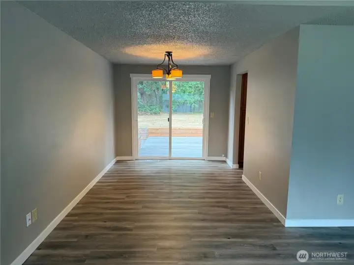 Dining Room. Wall could be easily removed to open up kitchen area. Non-load bearing.