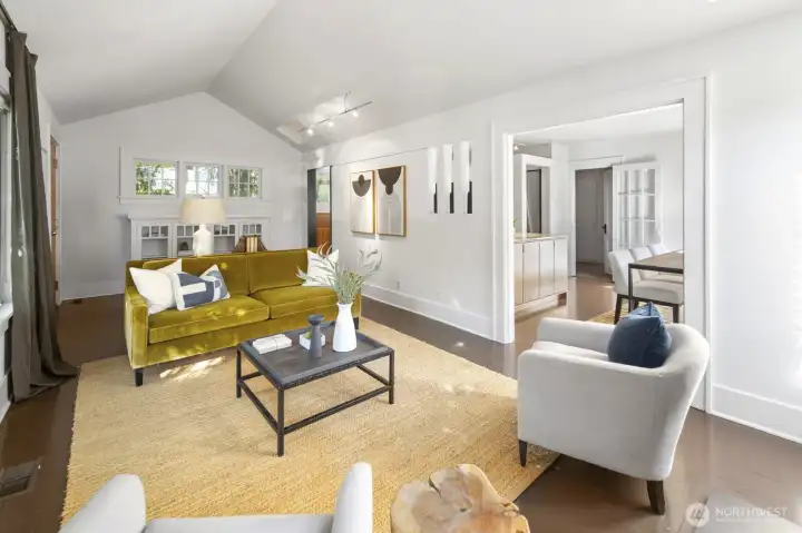Spacious living room with original built-ins and flexible layouts.