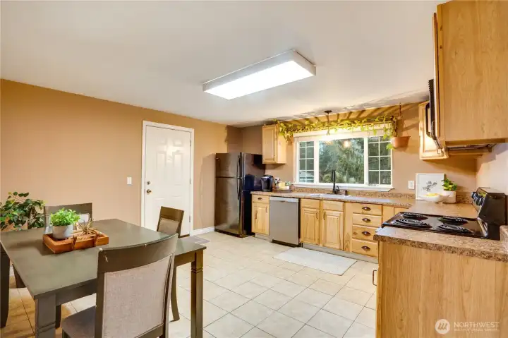 This roomy eat-in kitchen anchors the home—ideal for everyday meals or weekend baking sessions.