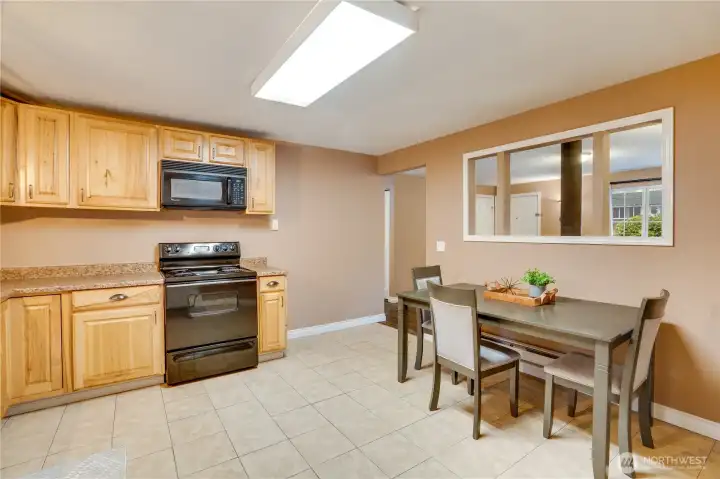 Bright and functional, this kitchen is designed for both style and practicality and the tile floors make clean up easy.
