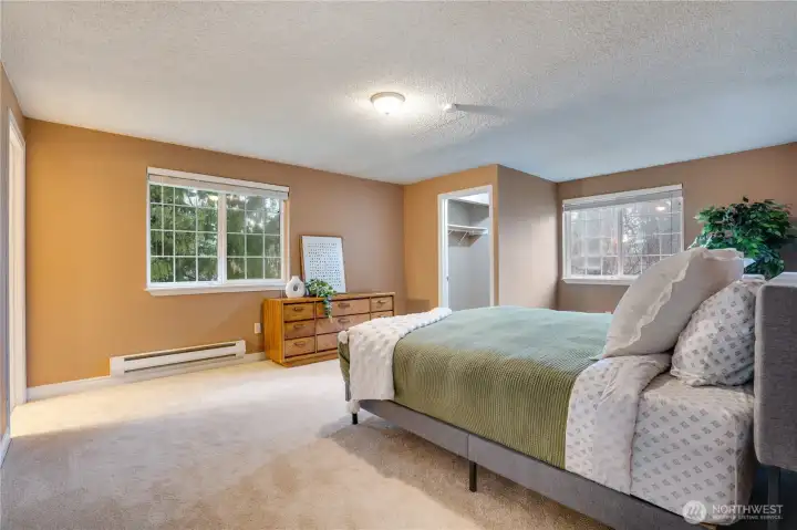 The expansive primary suite offers brand new carpet, a private half bath, and a walk-in closet for ultimate convenience.