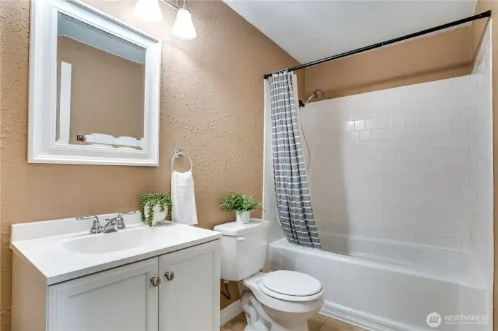 This sparkling full bath is bright, clean, and ready for everyday living.