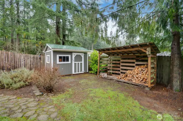 Keep tools organized in the garden shed and allow firewood to dry in the dedicated lean-to—ready for cozy nights by the stove in the living room.