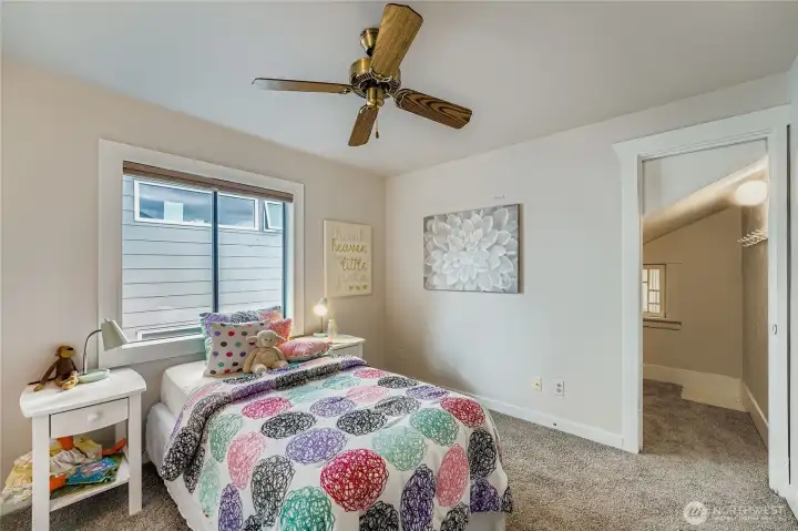 Bedroom at the back of the house, with a walk-in closet.