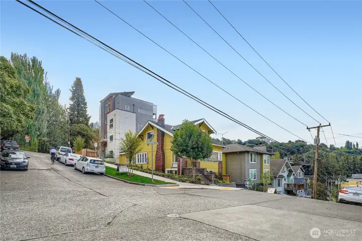 Bike parking on the front sidewalk. Townhomes behind the house are part of this Planned Unit Development.