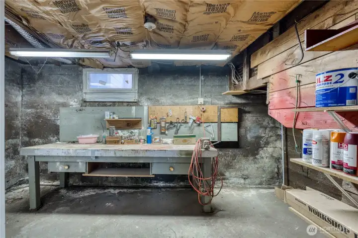 Great shop space in basement adjacent to the half bathroom.