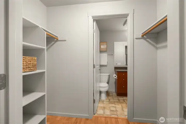 Walk in closet with access to the bathroom