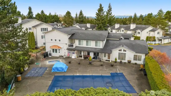 Aerial of the club house to the right of the picket fence at the top right is the enclosed mail box area for the complex