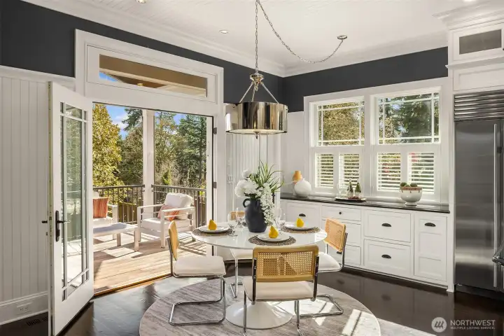 French doors open to sunny Tigerwood deck.