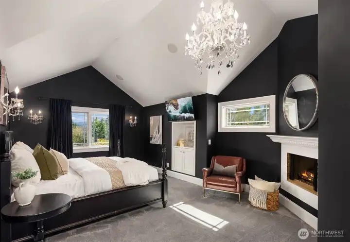 Luxurious master suite with peak-a-boo water and soothing territorial views with a gas fireplace.