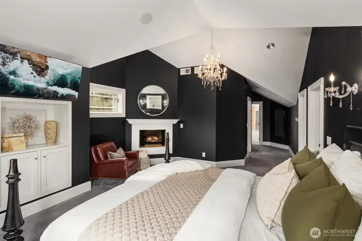 Door was added to connect primary suite to bonus room (can close off).  New carpet and statement chandeliers.