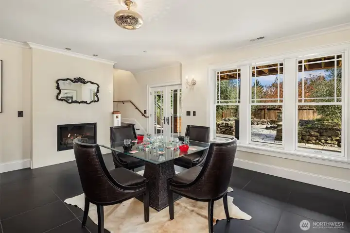 Italian soft floor tiles and porcelain wall tiles surround the gas fireplace.  Radiant heated floors.  French doors open to the backyard.