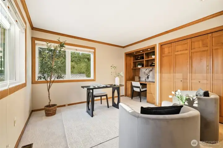 An executive office offers exceptional versatility, easily transforming into an additional bedroom with the inclusion of a Murphy bed.