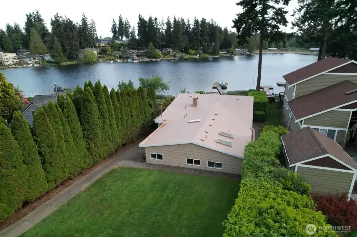 A beautiful view of the home and the lake.