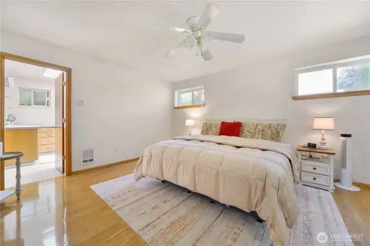 Primary suite with the door to the full bathroom.