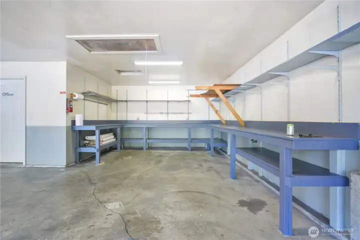 Shop area inside the three car garage. Office door goes to huge bonus space.
