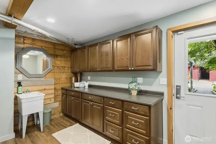 Separate mud room entrance. Next to 3/4 bath for washing off